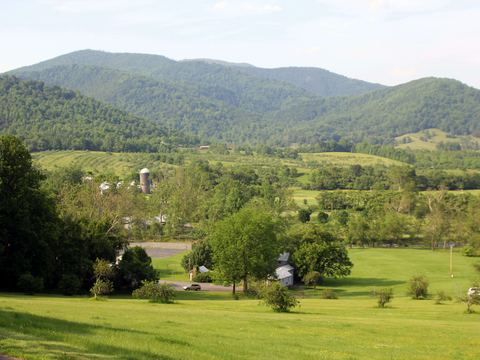 Rolling farmland below the Blue Ridge Mountains